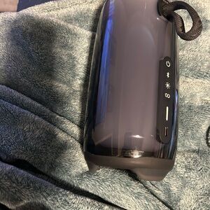 JBL speaker color is Gray and black lights up when you turn it on
